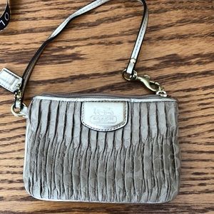Coach gold wristlet. Great condition.